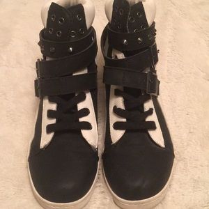 Black and white sneakers with gun metal studs